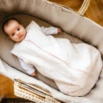 Cream baby sleeping bag with flower print