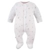 Baby-Set: Body, Strampelhose, Mütze und weißer Strampler mit Blättermotiv