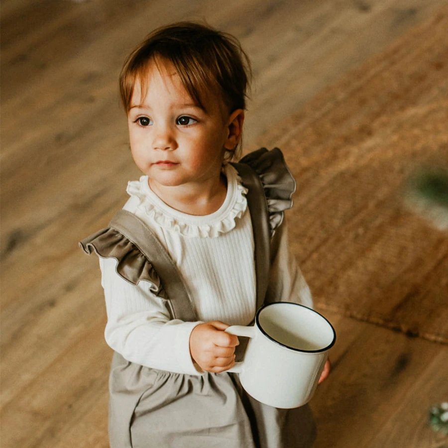 Elegante Babybodys mit Rüschen in Ecru