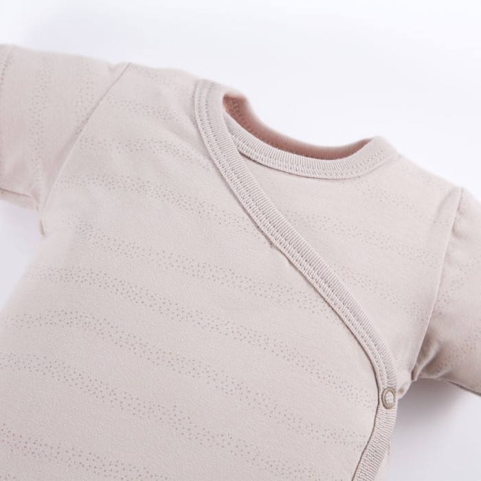 Beigefarbene Wickelbody mit zartem Aufdruck