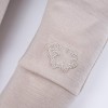 Beigefarbene Leggings aus Merinowolle, die mit dem Kind mitwachsen