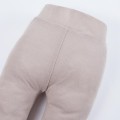 Beigefarbene Leggings aus Merinowolle, die mit dem Kind mitwachsen