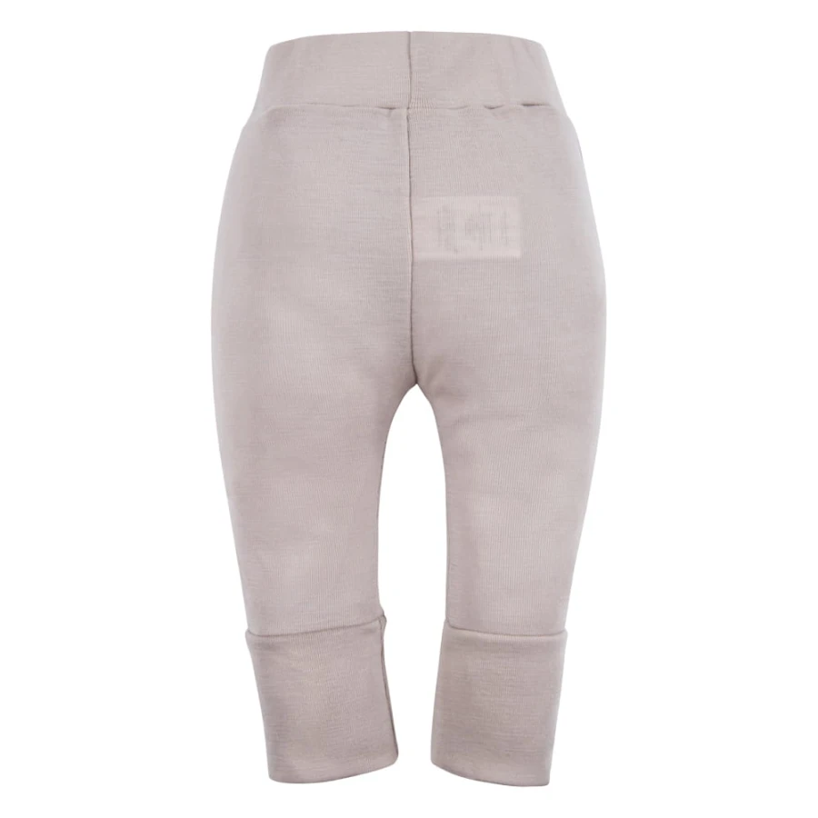 Beigefarbene Leggings aus Merinowolle, die mit dem Kind mitwachsen
